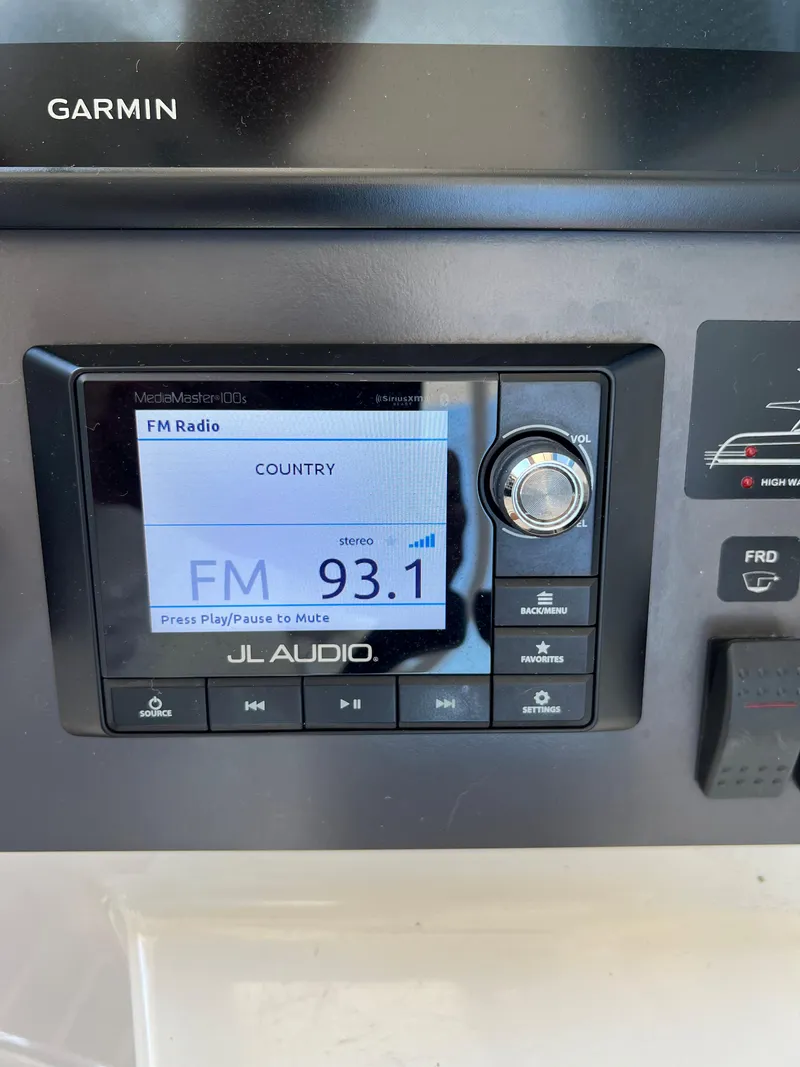 Slide: The Image of 2014 Maritimo 470 Offshore Convertible boat interior with cushioned seating and speaker. - 31