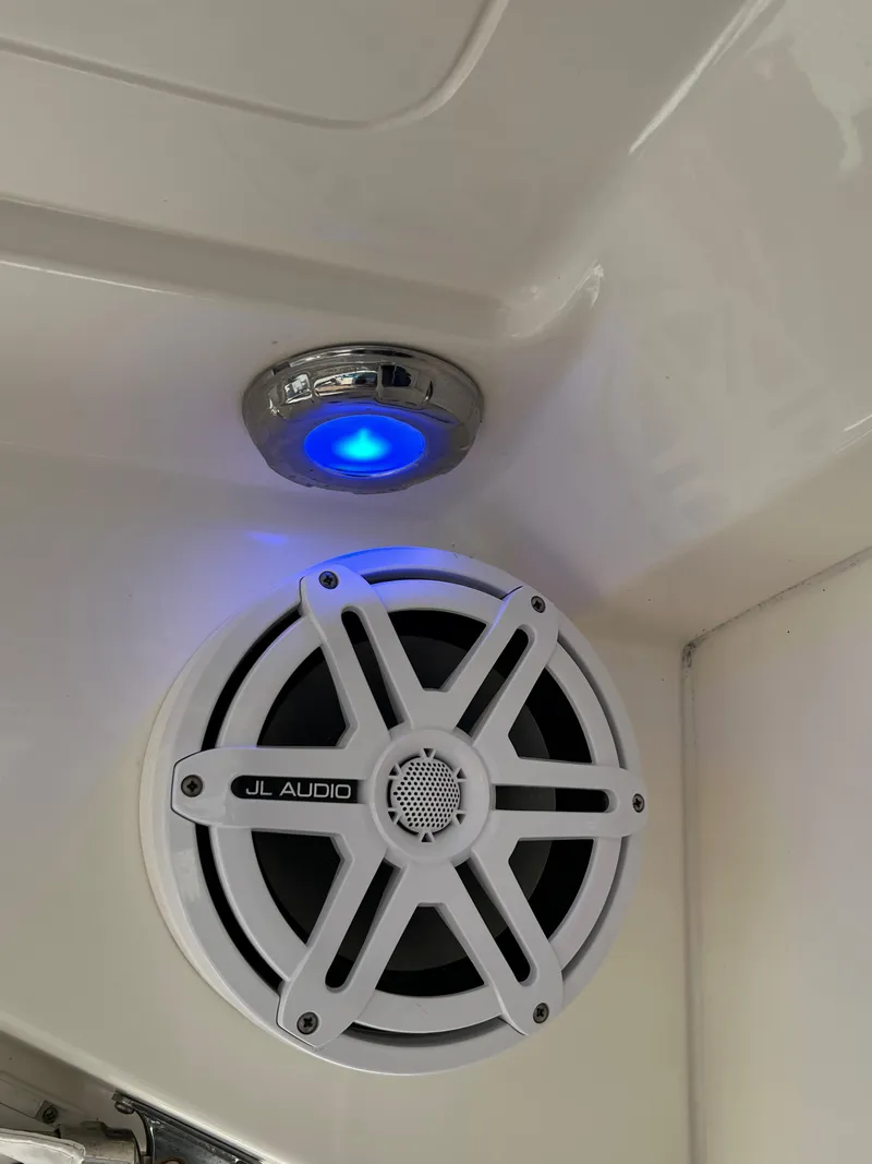 Slide: The Image of 2014 Maritimo 470 Offshore Convertible yacht cruising on a scenic waterway. - 32