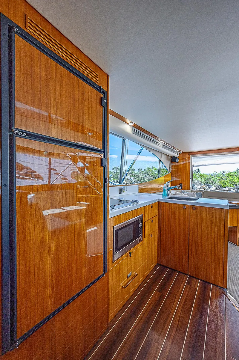 Slide: The Image of 2014 Maritimo 470 Offshore Convertible yacht cruising on open water. - 4