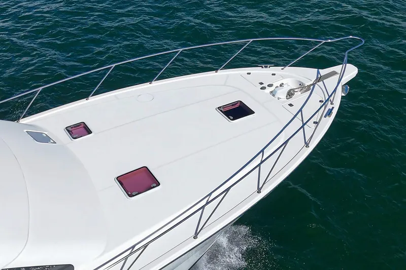 Slide: The Image of Luxurious bathroom in 2014 Maritimo 470 Offshore Convertible yacht, featuring wood accents and modern fixtures. - 48