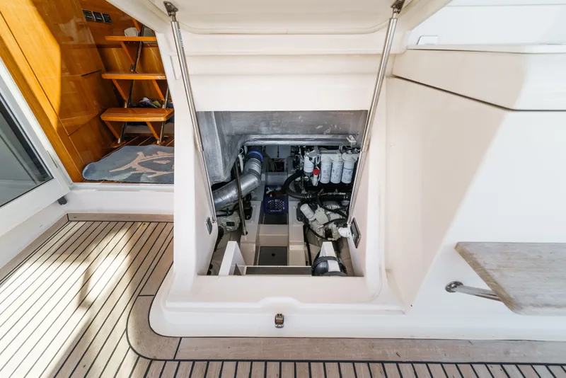 Slide: The Image of Control panel of 2014 Maritimo 470 Offshore Convertible yacht with navigation screens. - 56