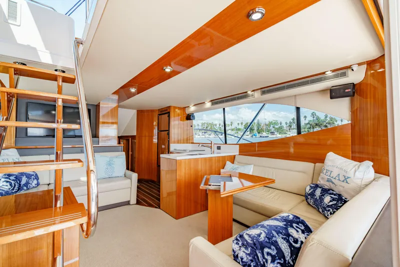 Slide: The Image of Dashboard of 2014 Maritimo 470 Offshore Convertible with navigation and control systems. - 58