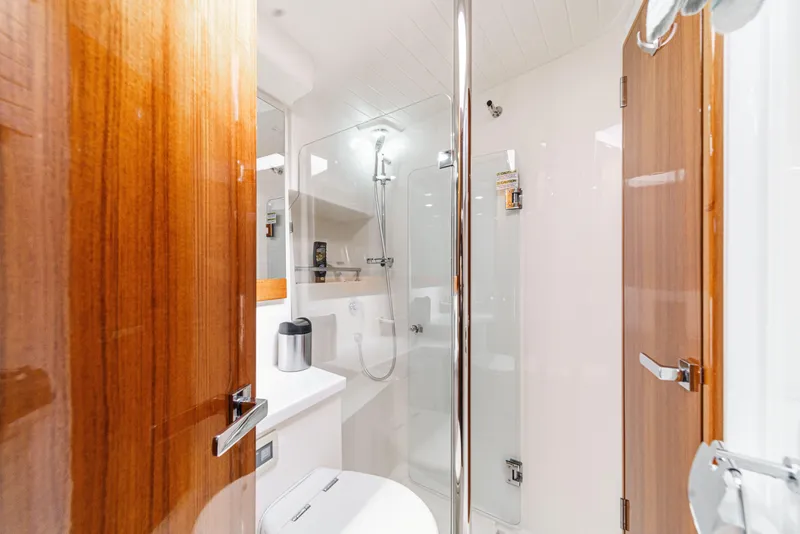 Slide: The Image of Engine room of 2014 Maritimo 470 Offshore Convertible yacht, showcasing dual engines and mechanical systems. - 67