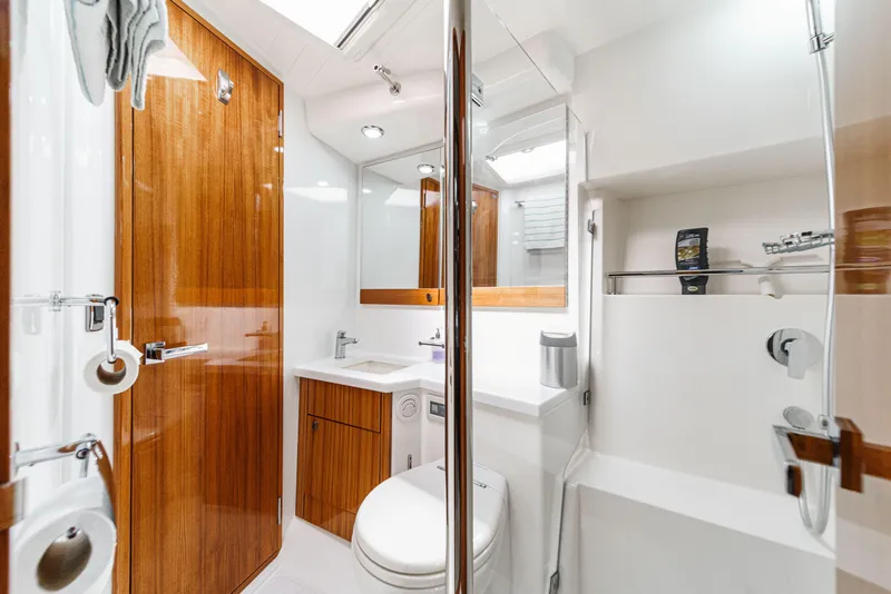 Slide: The Image of Engine room of 2014 Maritimo 470 Offshore Convertible yacht, showcasing machinery and components. - 68