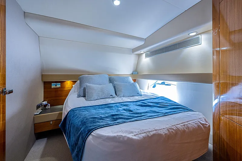 Slide: The Image of 2014 Maritimo 470 Offshore Convertible yacht in scenic marina with historic buildings. - 8