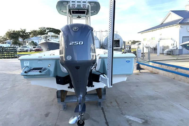Slide: The Image of 2023 Tidewater 2410 Bay Max boat with Yamaha 250 engine, docked outdoors. - 15