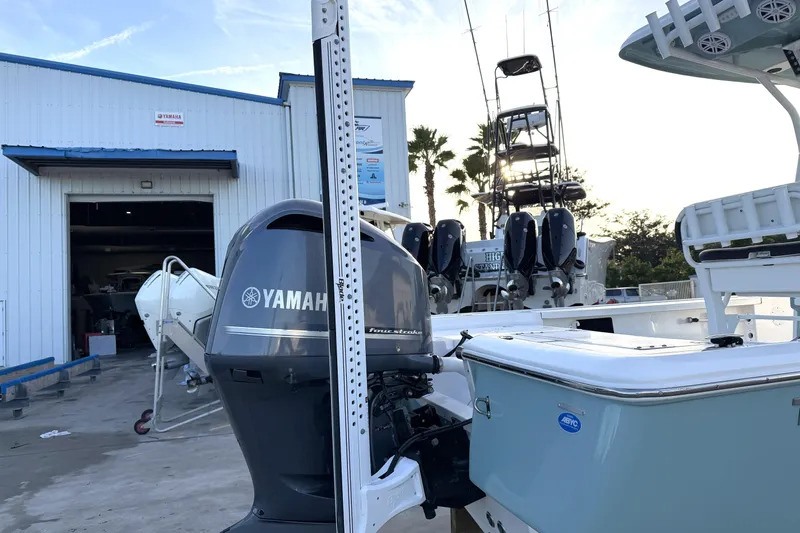 Slide: The Image of 2023 Tidewater 2410 Bay Max boat with Yamaha engine at a marina. - 18