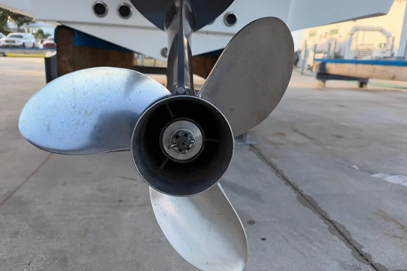 Slide: The Image of Close-up of a 2023 Tidewater 2410 Bay Max boat propeller on a concrete surface. - 19
