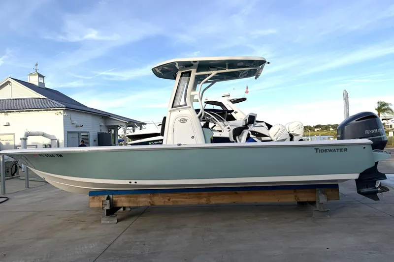 Slide: The Image of 2023 Tidewater 2410 Bay Max boat with Yamaha engine, docked at marina. - 3