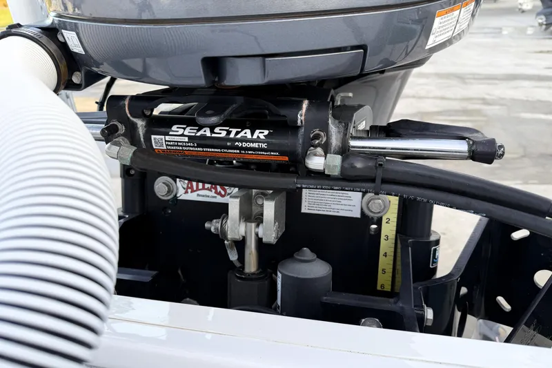 Slide: The Image of Close-up of SeaStar hydraulic steering system on 2023 Tidewater 2410 Bay Max boat. - 49
