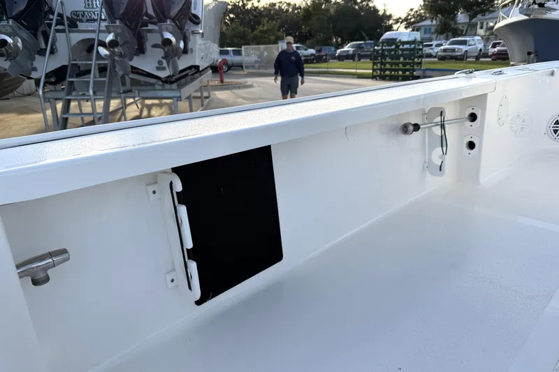 Slide: The Image of 2023 Tidewater 2410 Bay Max boat interior, showcasing storage and utility features. - 50