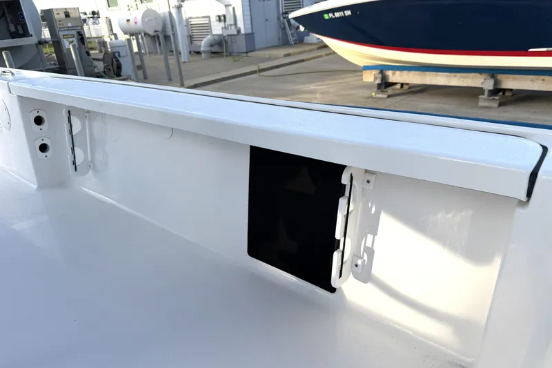 Slide: The Image of 2023 Tidewater 2410 Bay Max boat interior detail with storage compartment. - 51