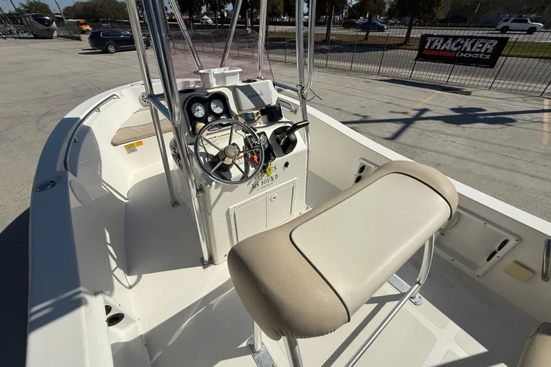 Slide: The Image of 2019 NauticStar 19 XS boat interior with steering console and seating. - 8