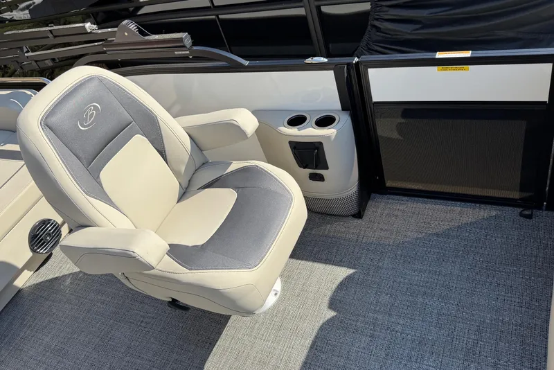 Slide: The Image of 2024 Barletta ARIA 22UC boat interior with plush seating and cup holders. - 10