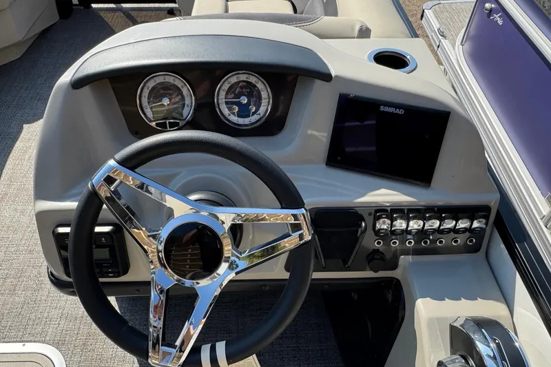 Slide: The Image of 2024 Barletta ARIA 22UC dashboard with steering wheel, gauges, and control panel. - 12