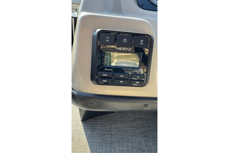 Slide: The Image of 2024 Barletta ARIA 22UC audio control panel with Bluetooth and volume buttons. - 16