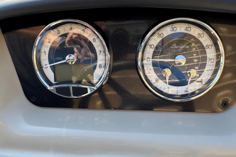 Slide: The Image of 2024 Barletta ARIA 22UC dashboard with RPM and speedometer gauges. - 17