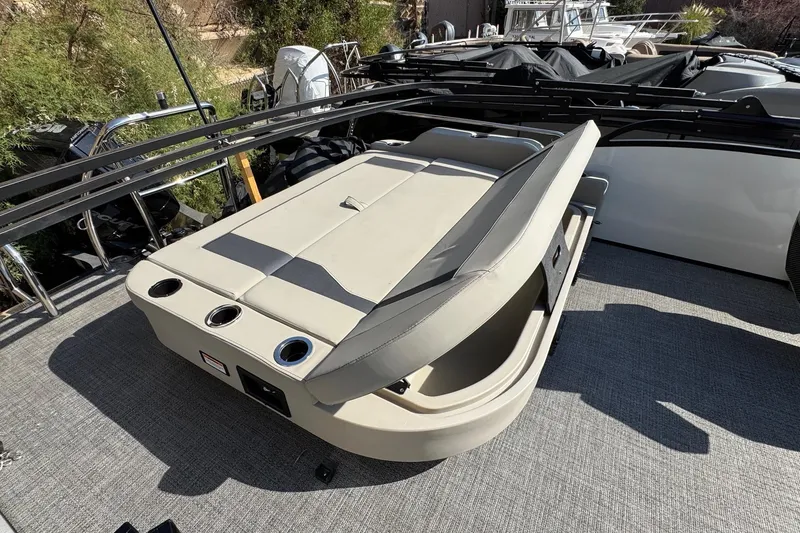 Slide: The Image of 2024 Barletta ARIA 22UC boat with adjustable seating and cup holders on deck. - 20