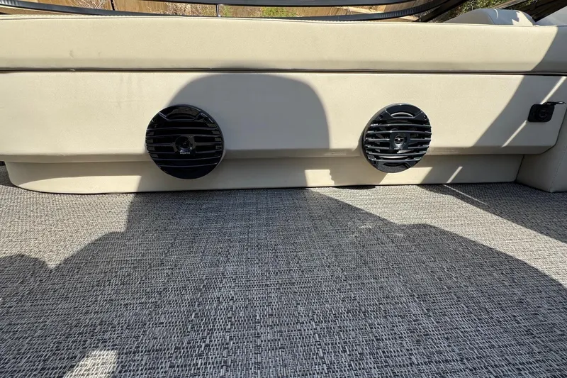 Slide: The Image of 2024 Barletta ARIA 22UC interior with dual speakers and textured flooring. - 24