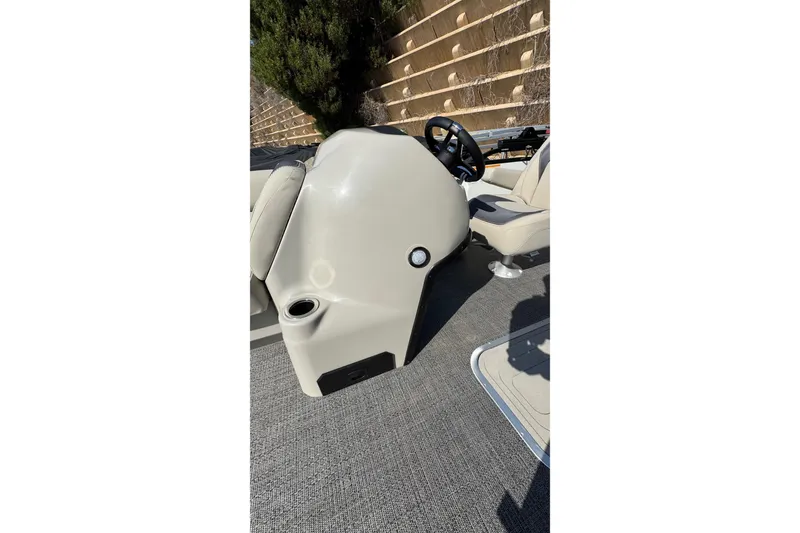 Slide: The Image of 2024 Barletta ARIA 22UC boat interior with steering wheel and seating. - 25