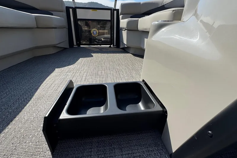 Slide: The Image of 2024 Barletta ARIA 22UC interior with cup holders and seating area. - 26