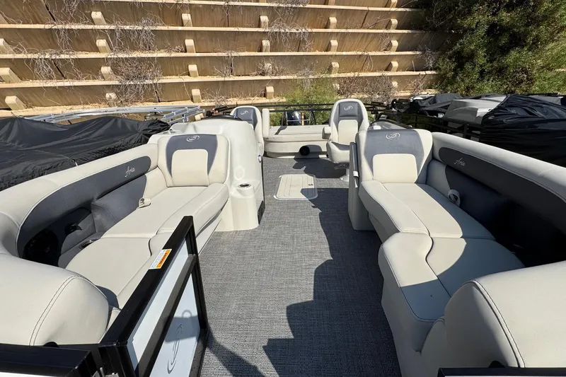 Slide: The Image of 2024 Barletta ARIA 22UC pontoon boat interior with plush seating and modern design. - 5