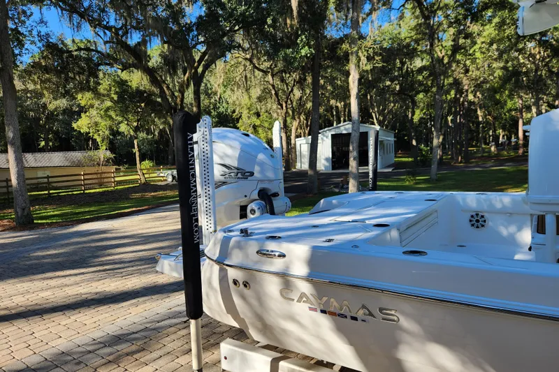 Slide: The Image of 2020 Caymas 28 HB boat in a wooded driveway setting. - 12
