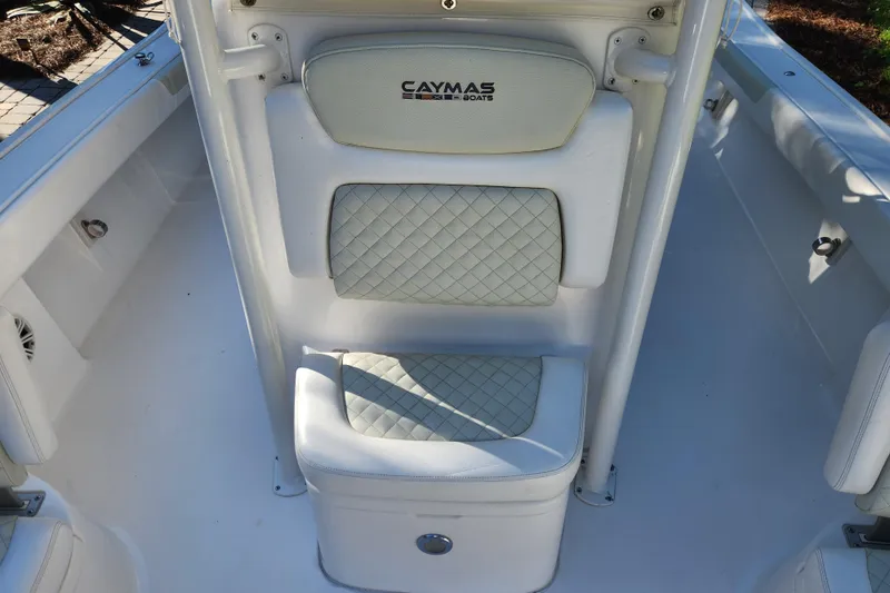 Slide: The Image of 2020 Caymas 28 HB boat interior with cushioned seating and storage. - 16