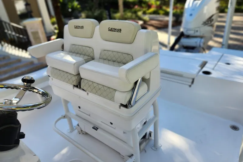 Slide: The Image of 2020 Caymas 28 HB boat with dual cushioned seats and steering wheel. - 33