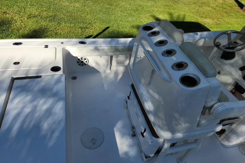 Slide: The Image of 2020 Caymas 28 HB boat interior with seating and steering wheel. - 48