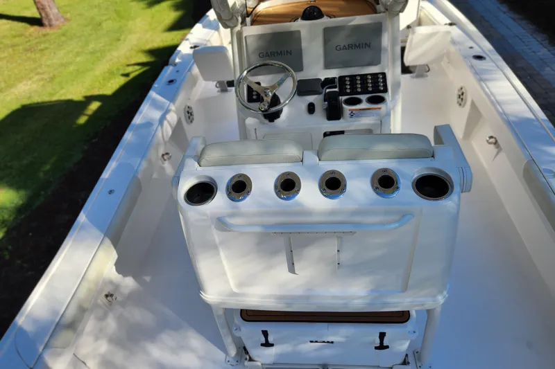 Slide: The Image of 2020 Caymas 28 HB boat interior with Garmin navigation system and rod holders. - 50