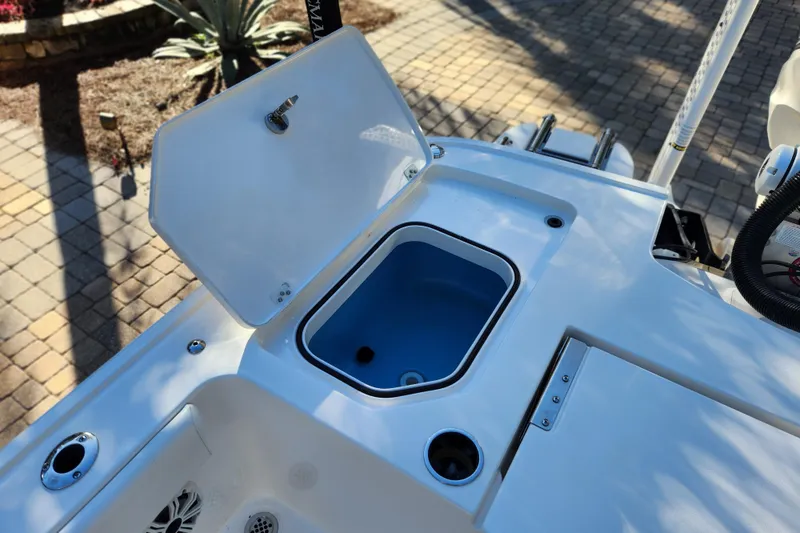 Slide: The Image of 2020 Caymas 28 HB boat deck with open storage compartment. - 52