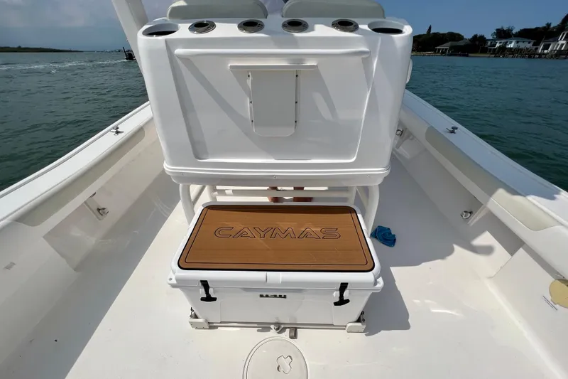 Slide: The Image of 2020 Caymas 28 HB boat interior with branded seating and ocean backdrop. - 62