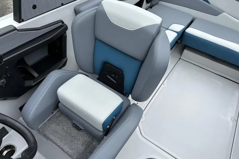 Slide: The Image of 2025 Axis T220 boat interior with gray and blue seating, modern design. - 12
