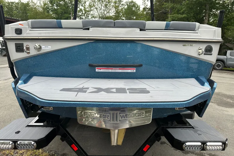 Slide: The Image of 2025 Axis T220 boat rear view with swim platform and Power Wedge III. - 3