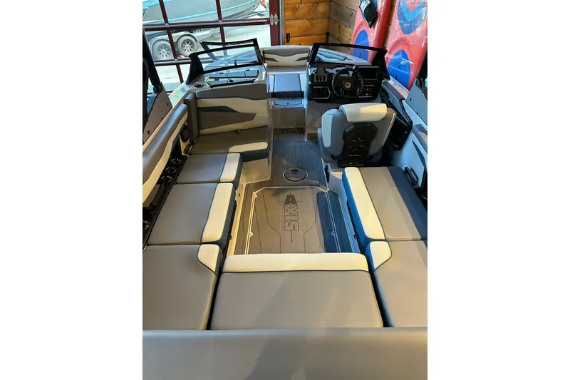 Slide: The Image of 2025 Axis T220 boat interior with spacious seating and modern dashboard design. - 9