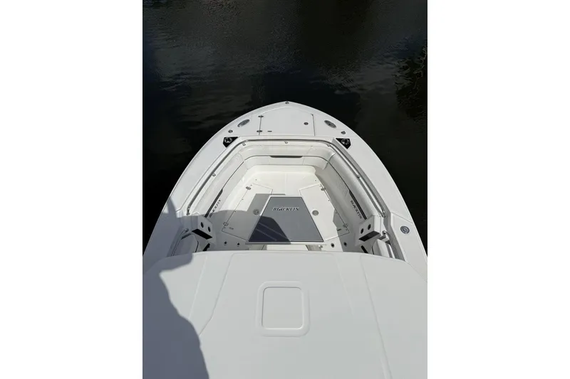 Slide: The Image of 2022 Blackfin 272 CC boat docked in a marina, viewed from above. - 21