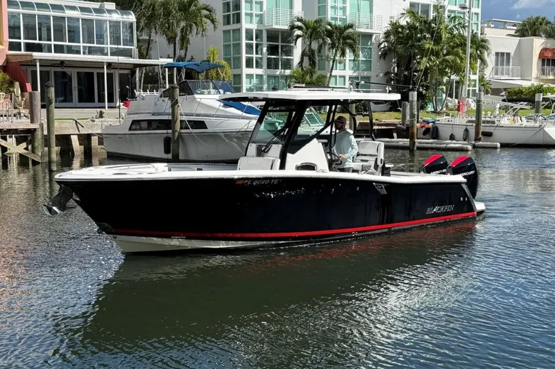 Slide: The Image of 2022 Blackfin 272 CC interior with toilet, storage, and control panel. - 7