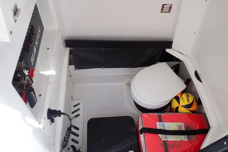 Slide: The Image of Twin Mercury 300 engines on a 2022 Blackfin 272 CC boat docked by water. - 8