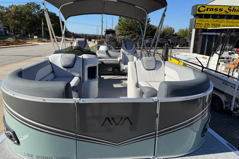 Slide: The Image of 2026 Avalon LSZ Versatile Rear Bench pontoon boat with stylish seating and canopy. - 15