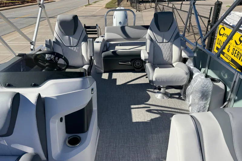 Slide: The Image of 2026 Avalon LSZ Versatile Rear Bench boat interior with modern seating and steering console. - 19