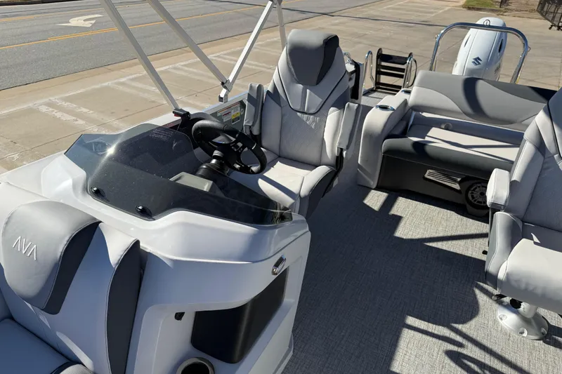 Slide: The Image of 2026 Avalon LSZ Versatile Rear Bench boat interior with modern seating and steering console. - 21