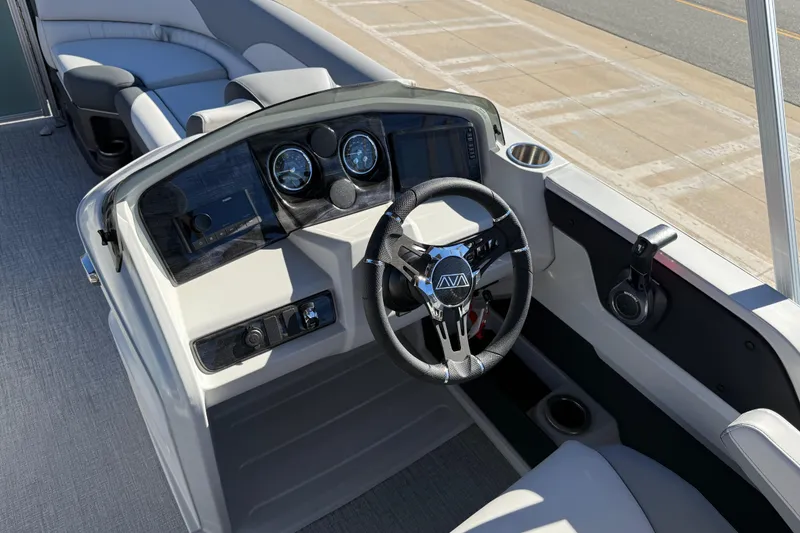 Slide: The Image of 2026 Avalon LSZ Versatile Rear Bench boat dashboard with steering wheel and seating. - 23