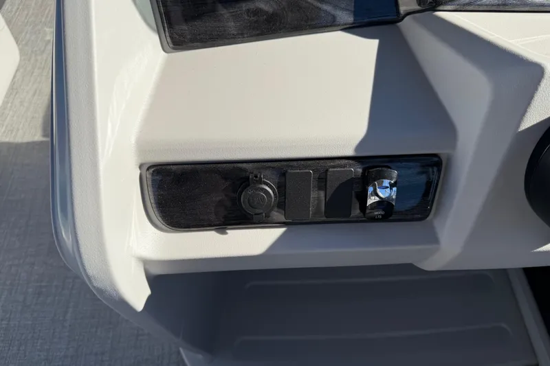 Slide: The Image of 2026 Avalon LSZ Versatile Rear Bench control panel with power outlet and switches. - 26