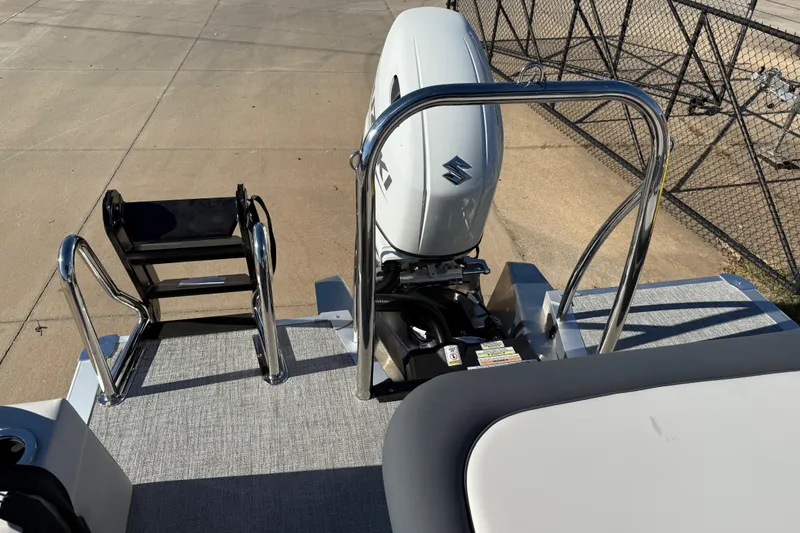 Slide: The Image of 2026 Avalon LSZ Versatile Rear Bench with Suzuki outboard motor and swim ladder. - 34