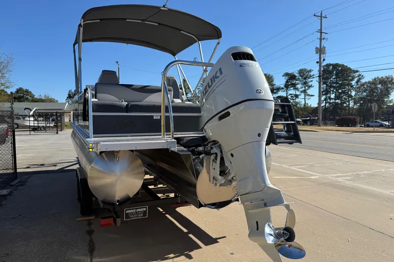 Slide: The Image of 2026 Avalon LSZ Versatile Rear Bench pontoon boat with Suzuki outboard motor. - 4