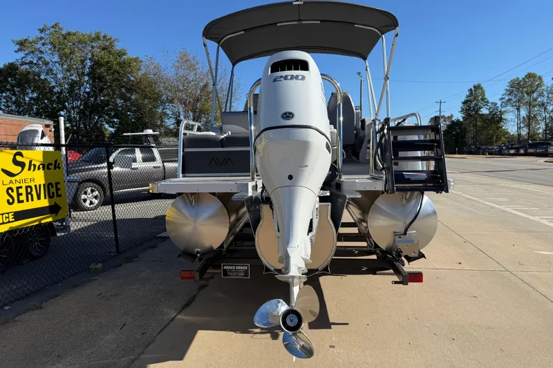 Slide: The Image of 2026 Avalon LSZ Versatile Rear Bench pontoon boat with powerful outboard motor. - 5