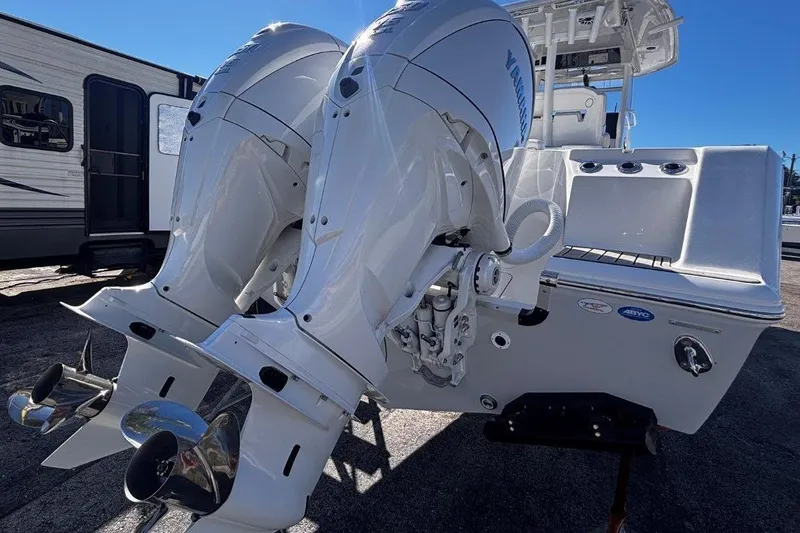 Slide: The Image of 2026 Tidewater 302 CC Adventure boat with dual Yamaha outboard engines. - 14