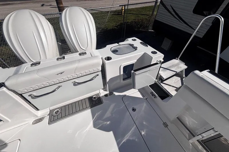 Slide: The Image of 2026 Tidewater 302 CC Adventure boat interior with seating and storage compartments. - 22