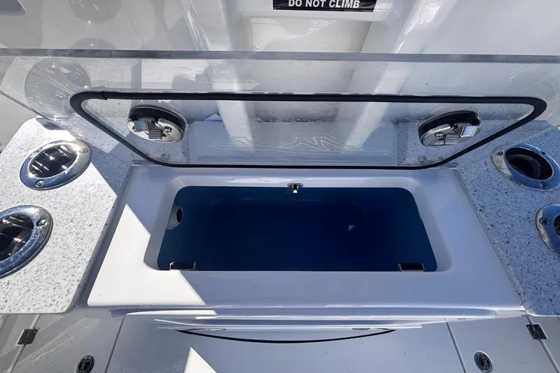 Slide: The Image of Open storage compartment on 2026 Tidewater 302 CC Adventure boat, featuring sleek design and functionality. - 33